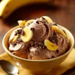 Delicious Chocolate Banana Greek Frozen Yogurt in a bowl with chocolate drizzle