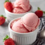 Bowl of healthy homemade Greek frozen yogurt topped with fresh fruits